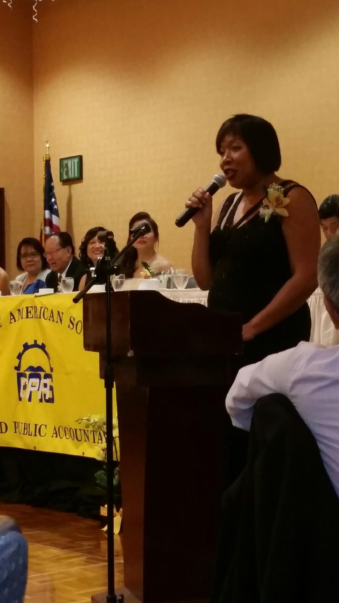 Ty speaking at an event